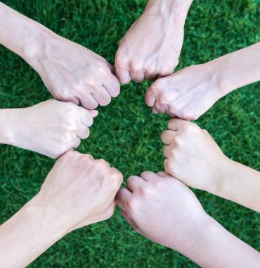 close-up-asian-business-people-hands-together-over-2026-01-06-09-18-45-utc