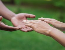 diverse-male-and-female-hands-stretch-to-each-othe-2026-03-24-03-04-11-utc